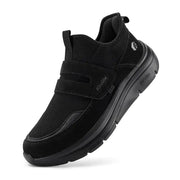 Black mesh and suede slip-on sneaker with a velcro strap, featuring the fitville brand logo on the side.