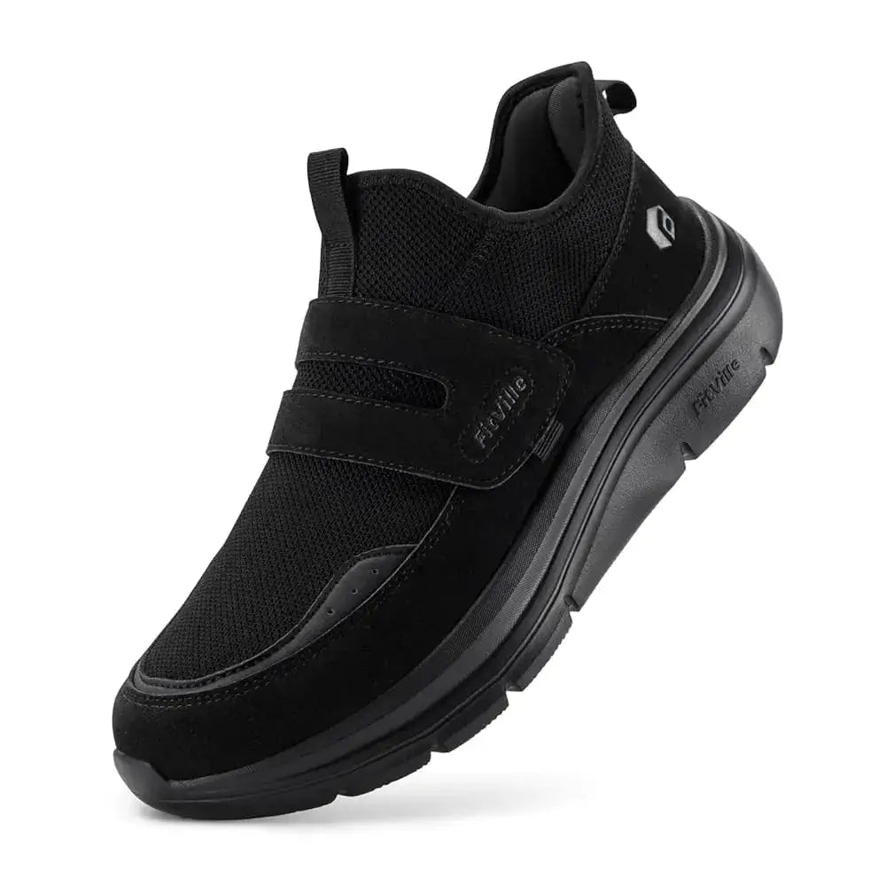 Black mesh and suede slip-on sneaker with a velcro strap, featuring the fitville brand logo on the side.