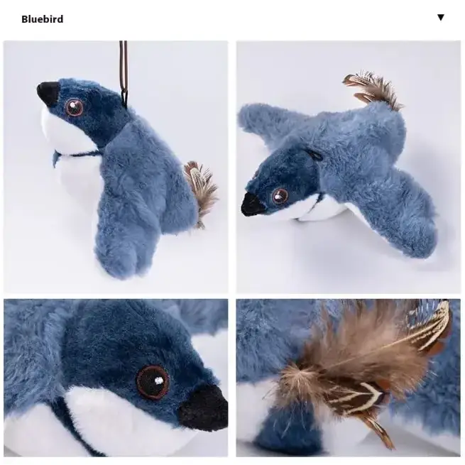 Blue plush bird keychain with soft blue and white fur, brown feather accents on wings and tail.