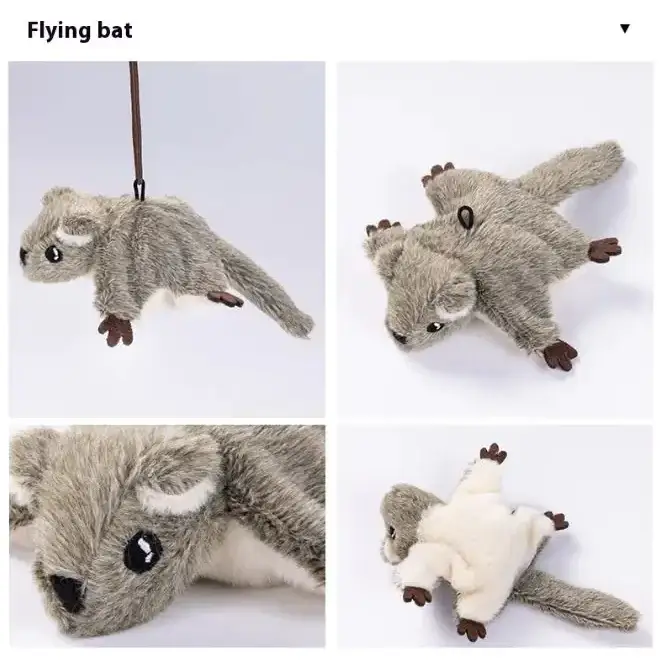 Gray plush flying squirrel toy with soft fur, black button eyes and nose, brown paws and tail tip.