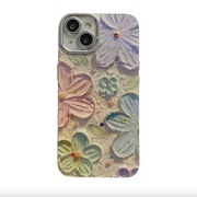 Pastel-colored floral phone case with raised, textured petals and jeweled centers.