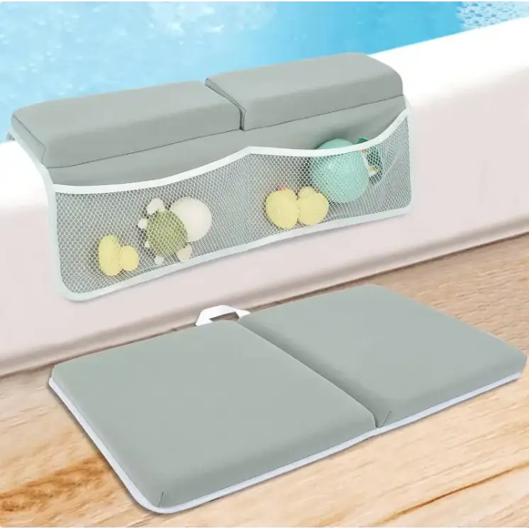 Gray inflatable bath safety pad with mesh storage pocket holding colorful toys.