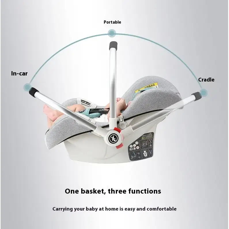 Gray fabric baby car seat with a white plastic frame and black accents, designed for portable in-car use.