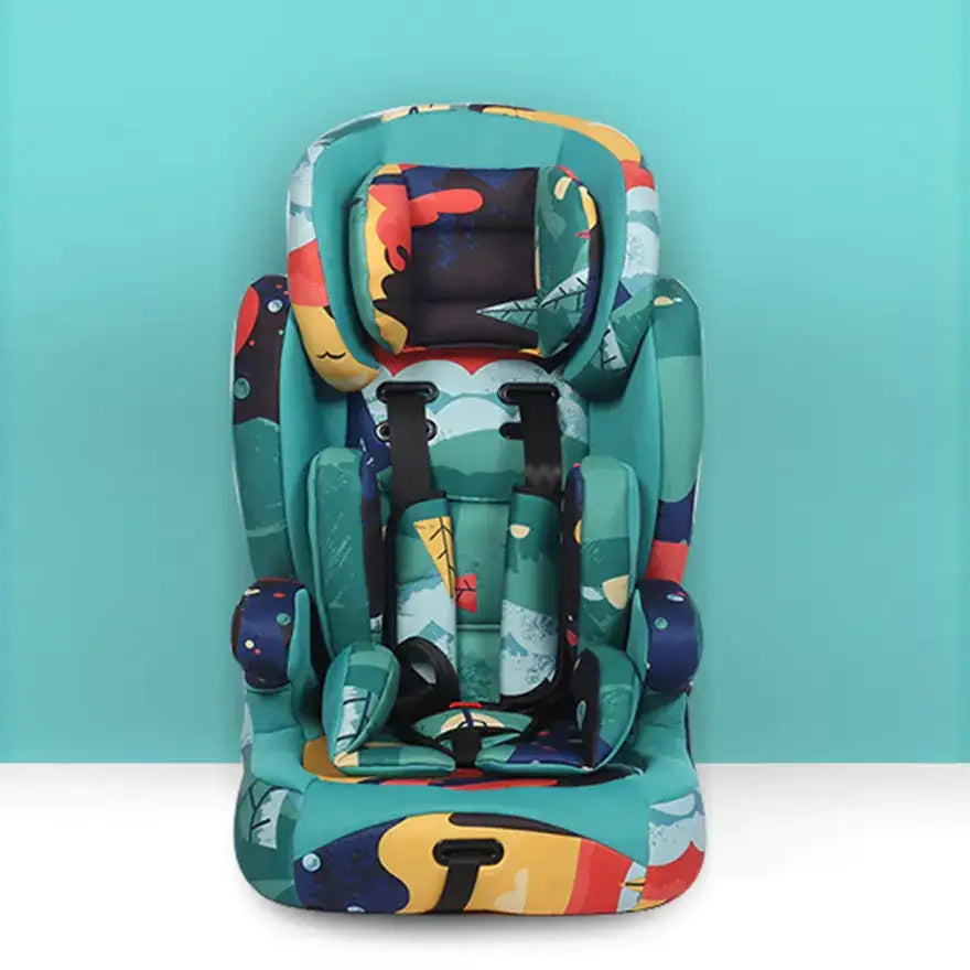 A vibrant, teal-colored children’s car seat with a playful abstract pattern in reds, yellows, and blues.
