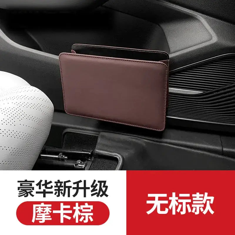 Brown leather car organizer with a sleek, minimalist design.