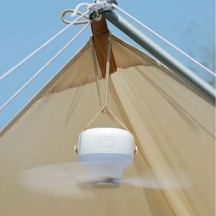 White portable ceiling fan with a sleek, rounded design and fabric straps for hanging.