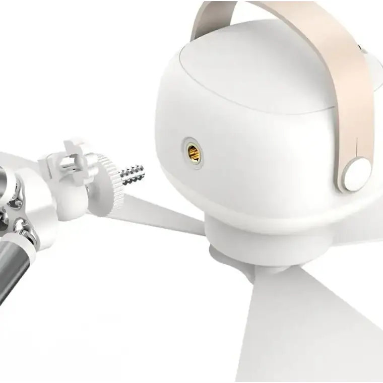 White spherical lamp with a beige leather strap and gold-colored accent.