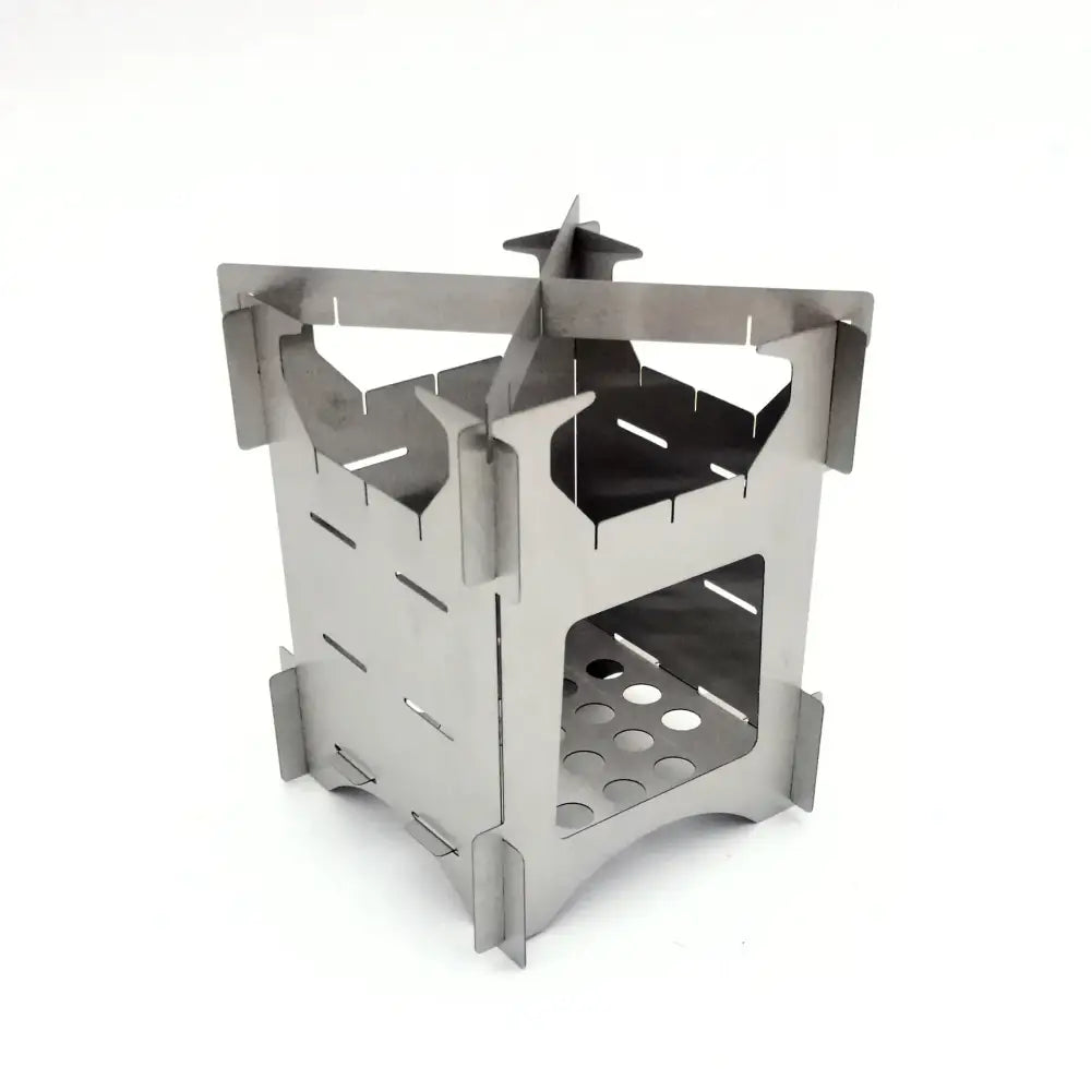 Silver stainless steel foldable camp stove with a castle-like design and perforated base.
