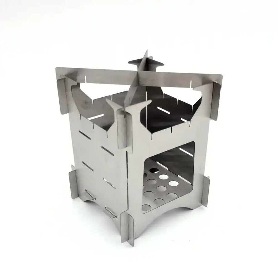 Silver stainless steel foldable camp stove with a castle-like design and perforated base.
