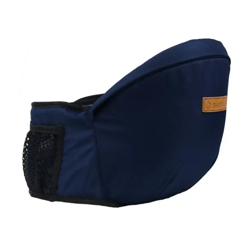 Navy blue fabric baby carrier with black mesh pocket and brown leather brand patch