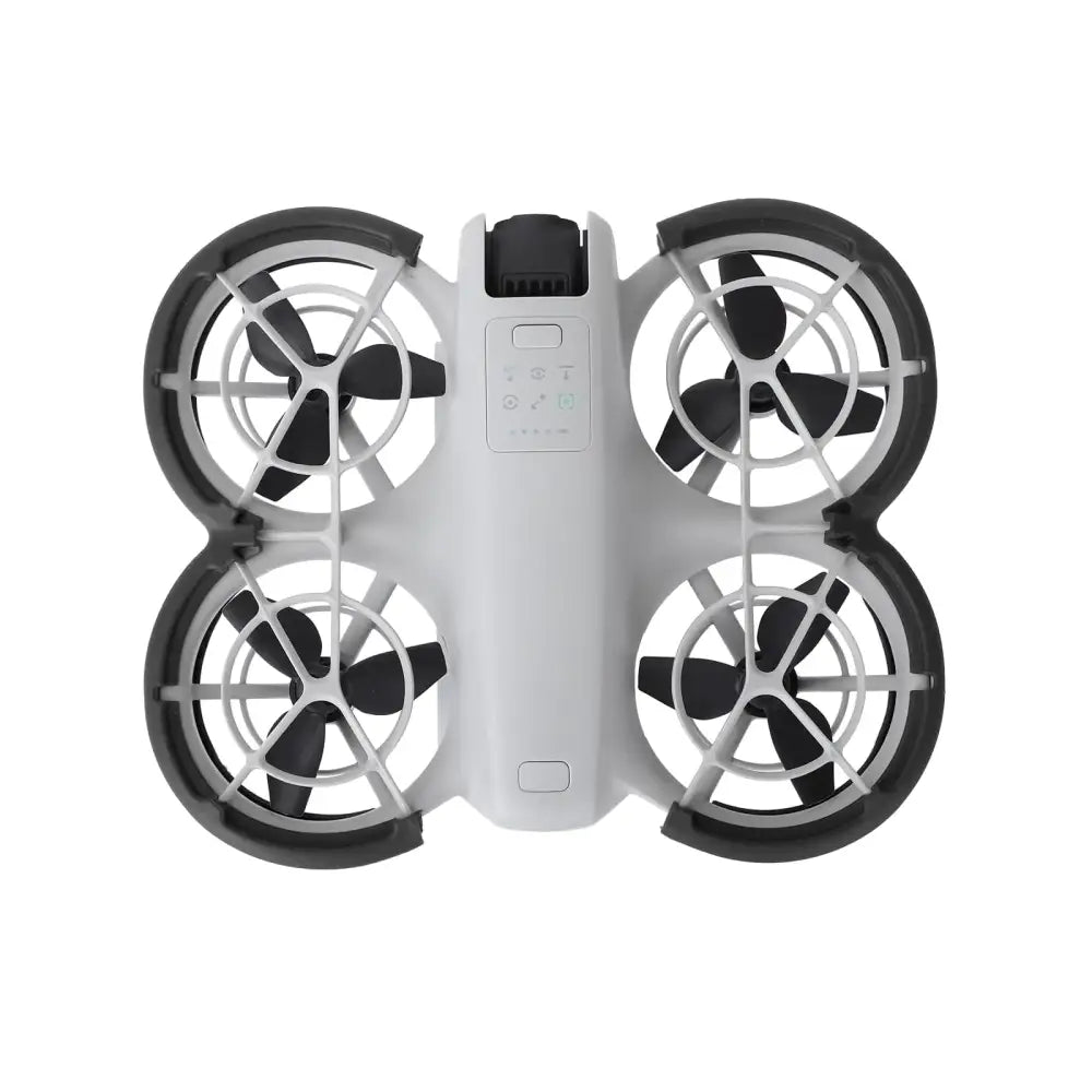 White and black quadcopter drone with four propellers, each enclosed in a protective frame.
