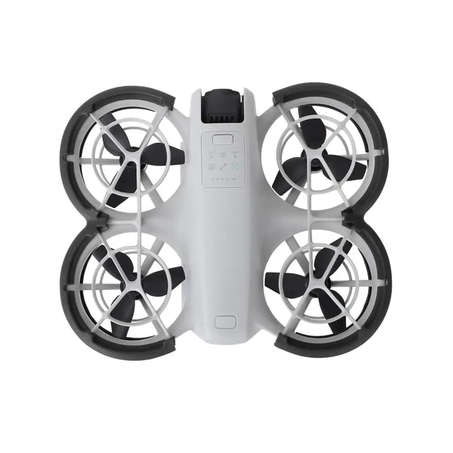 White and black quadcopter drone with four propellers, each enclosed in a protective frame.