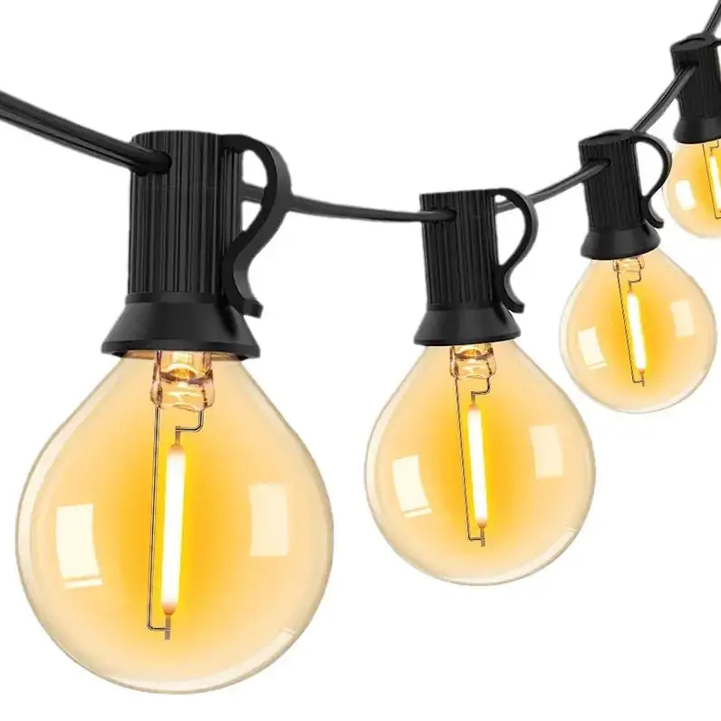 String of black-clad edison-style globe lights with warm amber glass bulbs.