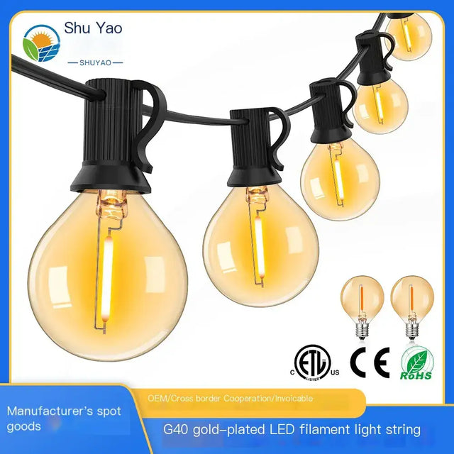 G40 gold-plated led filament light string with warm amber glass bulbs and black plastic clips.