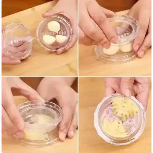 Clear plastic garlic press with a circular base and lid, designed for crushing cloves into paste.