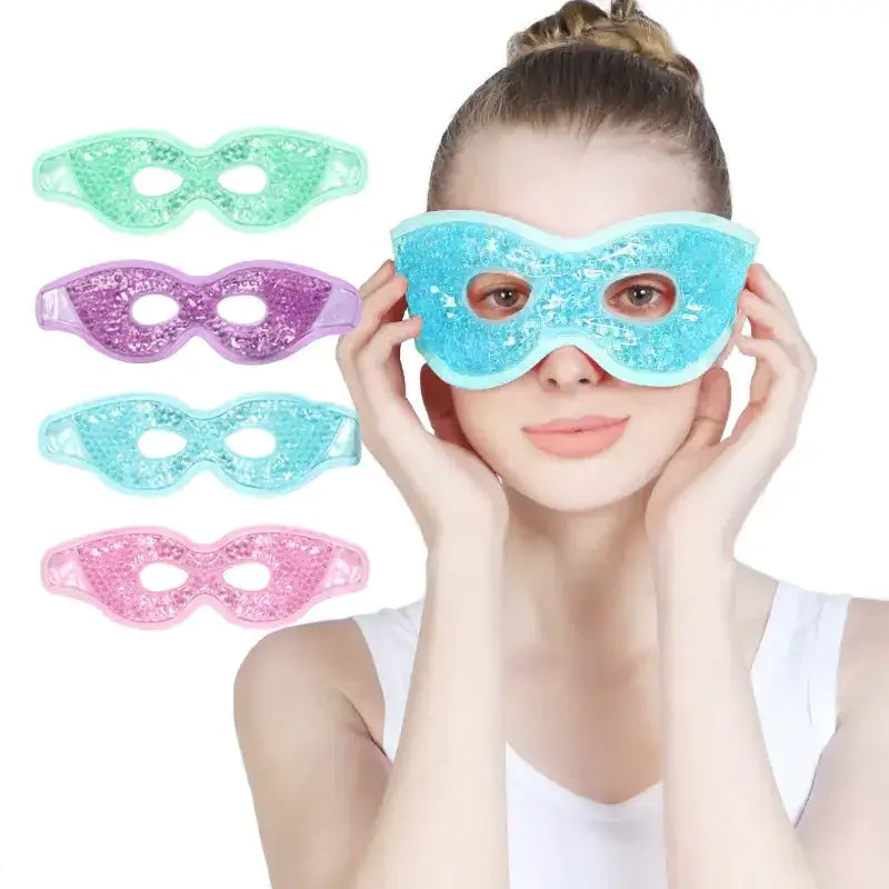 A woman wearing a blue glittery gel eye mask with an adjustable strap.