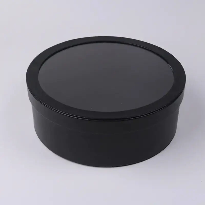 Black round gift box with a smooth, glossy finish and a matching lid.