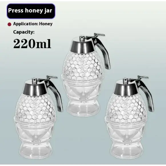 Clear glass honey press jars with a hexagonal pattern and silver metal tops, each featuring an ergonomic handle for easy squeezing.