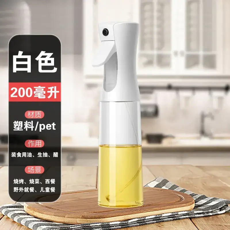 White plastic spray bottle with a transparent lower section containing yellow liquid, designed for storing cooking oil or vinegar.