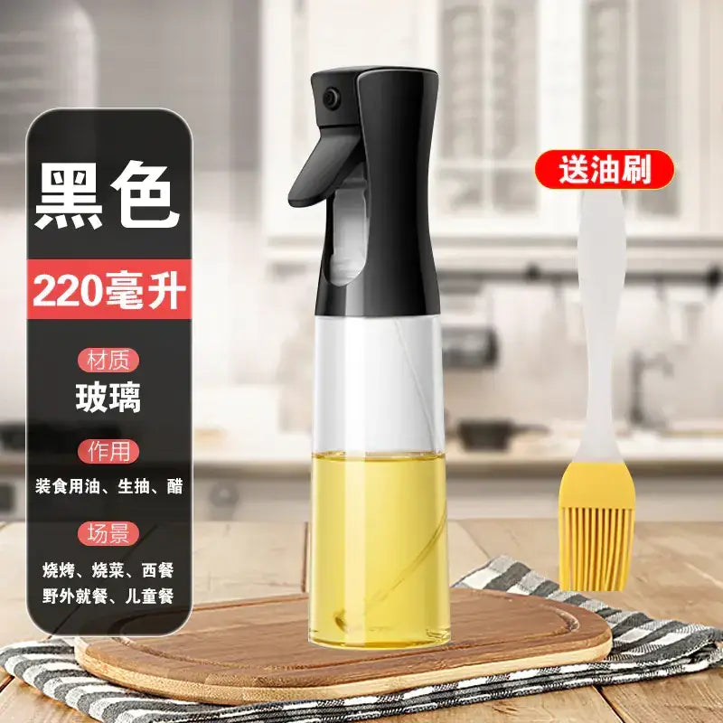 Black spray bottle with a clear glass body containing yellow liquid, designed for storing cooking oil or vinegar.