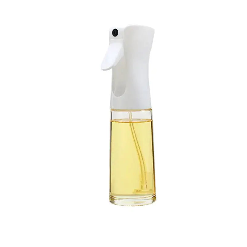 Clear glass spray bottle with a white plastic nozzle and trigger, filled with golden-yellow liquid.