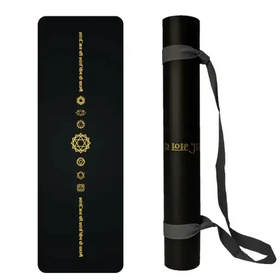 Black yoga mat with gold chakra symbols and text, rolled in a black carrying tube with gray straps.