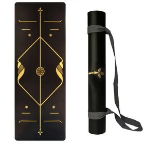 Black yoga mat with gold geometric and floral designs, rolled in a black carrying tube secured by gray straps.
