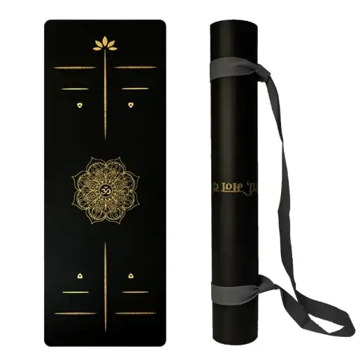 Black yoga mat with gold geometric and mandala designs, rolled in a black carrying tube with gray strap.