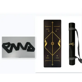 Black yoga mat with gold geometric design and carrying strap
