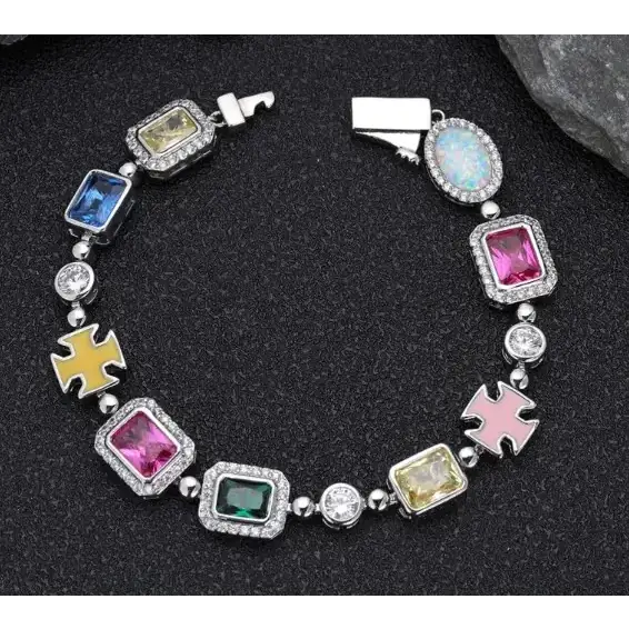 A vibrant, multi-colored gemstone bracelet featuring a silver-toned metal frame with pave-set crystals and alternating colorful rectangular stones in yellow, blue, pink, green, and opal hues.