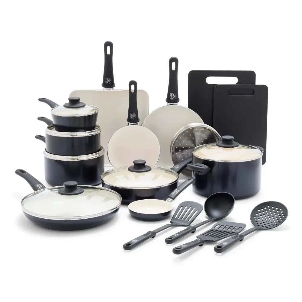 Black and white ceramic nonstick cookware set with black handles and matching lids.