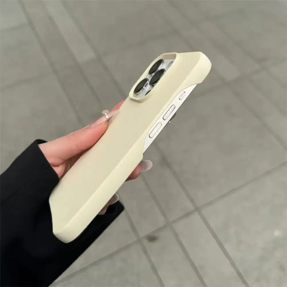 Cream-colored silicone phone case with a smooth, matte finish and precise cutouts for the camera module.