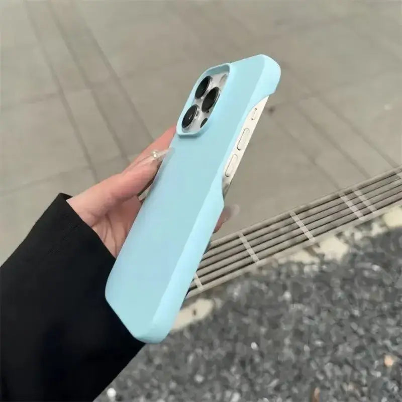 A sleek, light blue silicone phone case with a smooth matte finish and precise cutouts for the camera lenses.