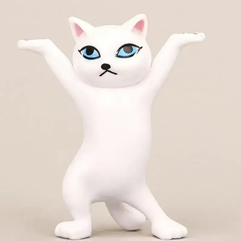 White plastic cat figurine with striking blue eyes and pink inner ears, posed in a playful standing stance.
