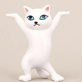 White plastic cat figurine with striking blue eyes and pink inner ears, posed in a playful standing stance.