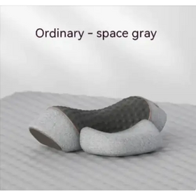 Space gray, textured ergonomic pillow with a sleek, modern design.