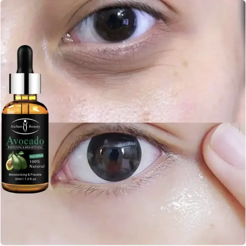 A clear glass bottle with a black dropper cap and silver collar, containing amber-colored avocado face serum labeled ’100% natural’ by aichun beauty.