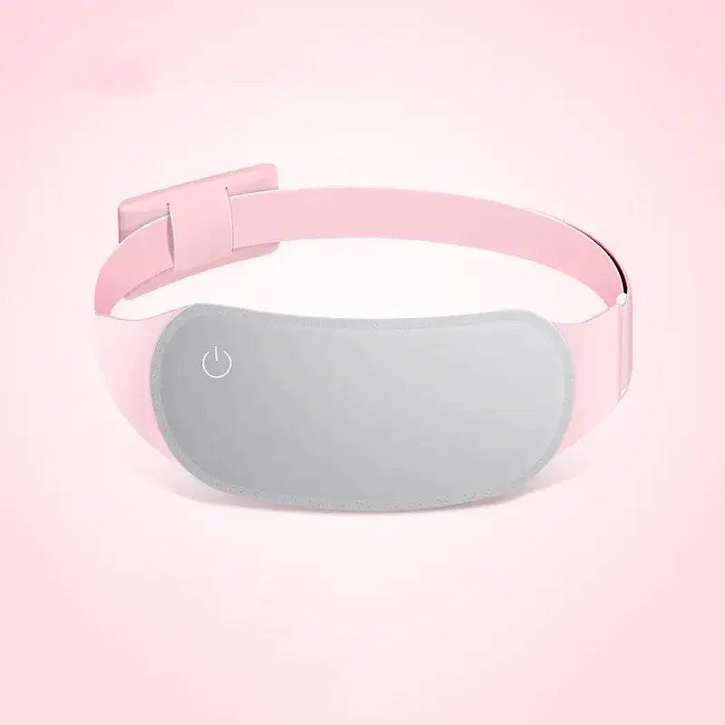 Pink and gray heated eye mask with a soft, smooth surface and an adjustable strap.