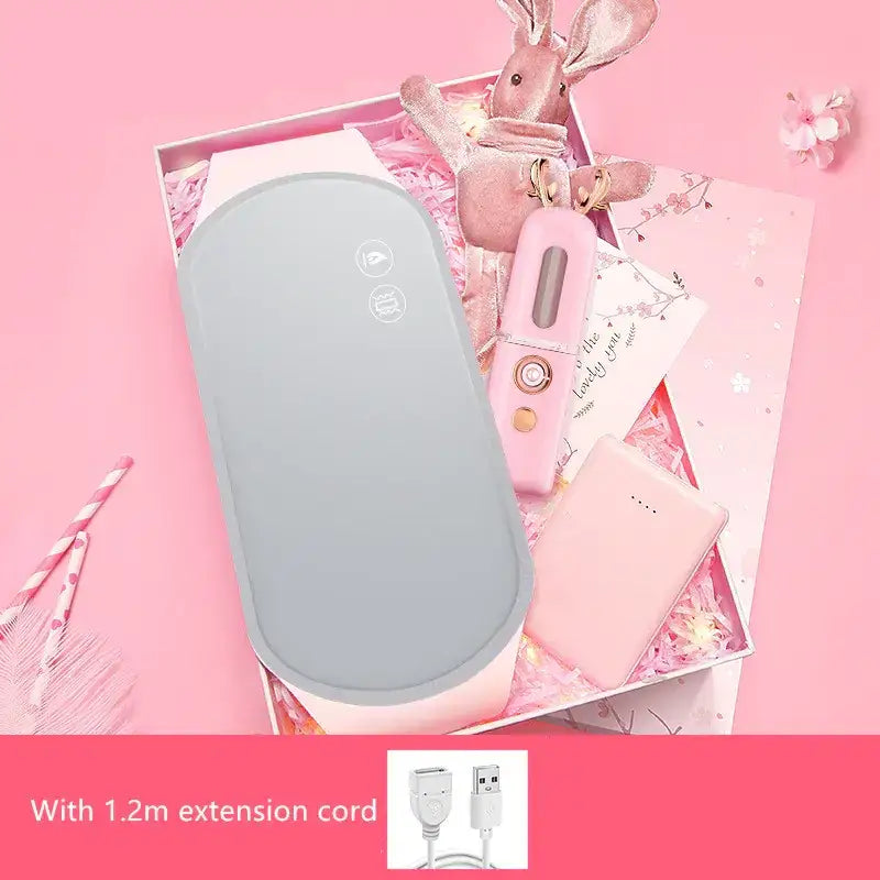 Light gray oval-shaped portable heater with two circular control buttons on the top surface.
