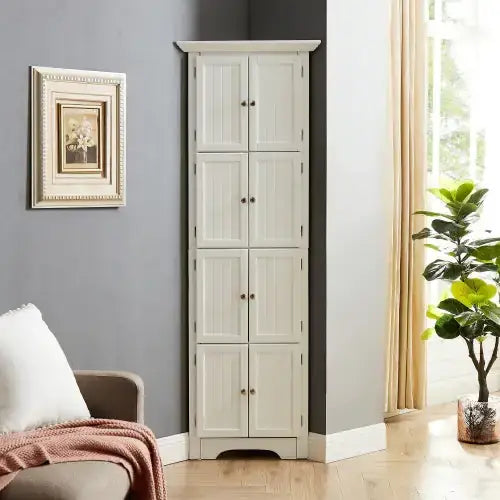 White wooden corner cabinet with six doors and black round knobs