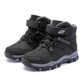 Black and gray children’s winter hiking boots with a durable rubber sole and adjustable strap closure.