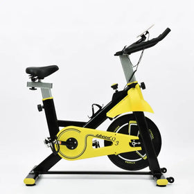 Yellow and black stationary exercise bike with a sleek, modern design.