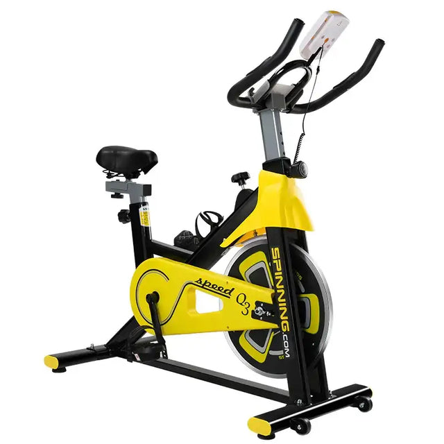 Yellow and black spinning.com speed q3 exercise bike with a sleek, modern design.