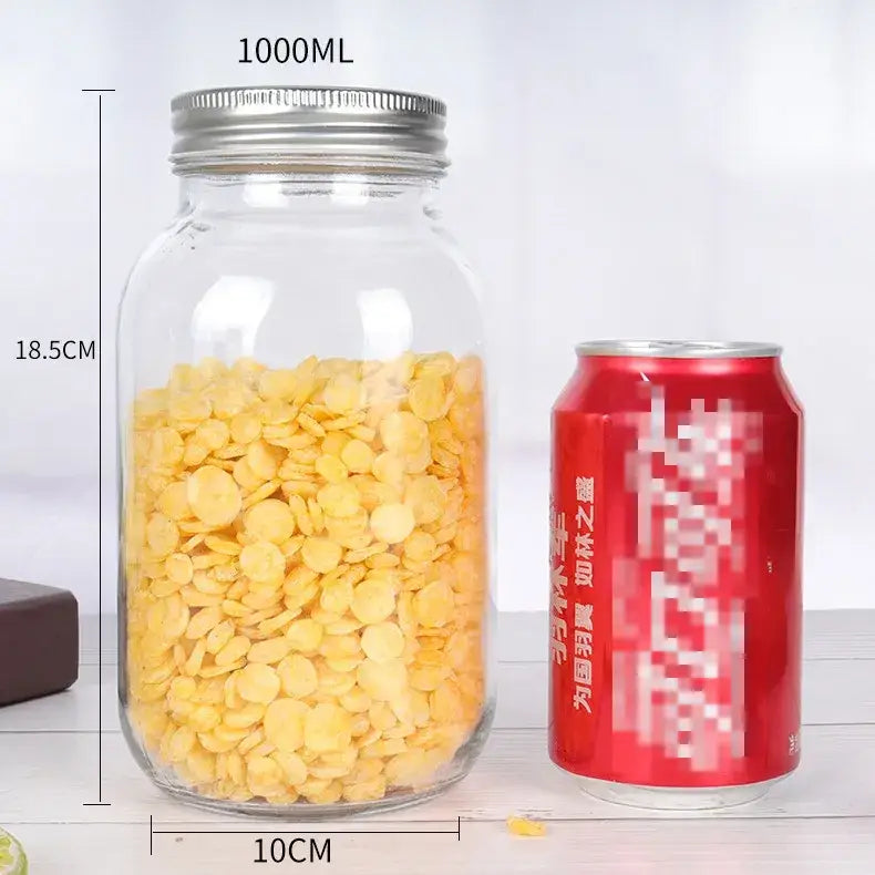 Clear glass jar with a silver metal lid, filled with yellow circular chips.