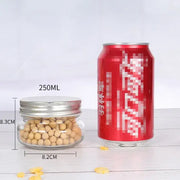 A clear glass jar with a silver metal lid, filled with light brown soybeans.