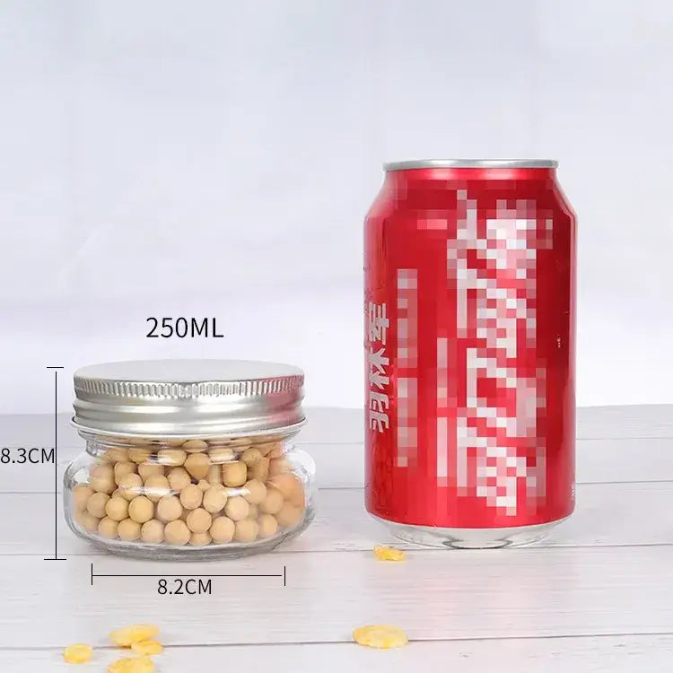 A clear glass jar with a silver metal lid, filled with light brown soybeans.