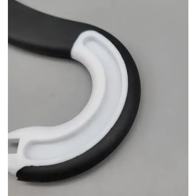 Black and white plastic hook with a curved, ergonomic design.