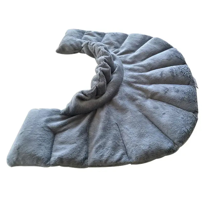 A plush, gray faux fur throw blanket with a soft, textured surface and quilted sections.