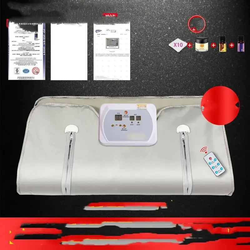 Light gray fabric-covered infrared sauna blanket with a central digital control panel and side zippers.