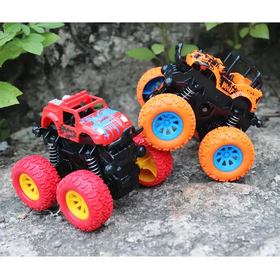 Red and black monster truck toy with yellow wheels, orange and blue monster truck toy with matching bright tires.